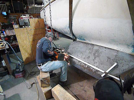 Rob cut about 6 inches off the bottom of each keel with a gas-powered concrete saw.